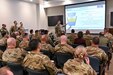Col. Deane E. Thomey, 111th Attack Wing commander, briefs Air Combat Inspector General team members during an in-brief for a Unit Effectiveness Inspection of the 111th ATKW prior to beginning their inspections at Biddle Air National Guard Base in Horsham, Pennsylvania on Dec. 2, 2022. The 111th ATKW was rated overall "effective" during the inspection.  (U.S. Air National Guard Photo by Tech. Sgt. Ross A. Whitley)