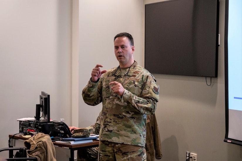 Col. Deane E. Thomey, 111th Attack Wing commander, briefs Air Combat Inspector General team members during an in-brief for a Unit Effectiveness Inspection of the 111th ATKW prior to beginning their inspections at Biddle Air National Guard Base in Horsham, Pennsylvania on Dec. 2, 2022. The 111th ATKW was rated overall "effective" during the inspection.  (U.S. Air National Guard Photo by Tech. Sgt. Ross A. Whitley)