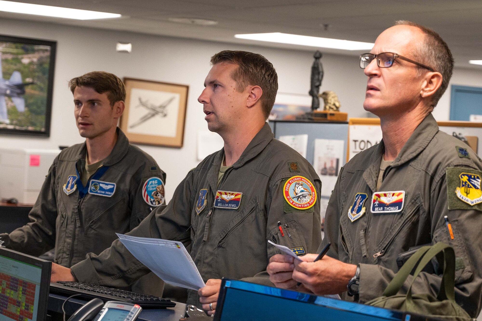 1st Lt. Nathan Thomas (left) and his dad, Lt. Col. Joseph Thomas (right) prepare to fly a training mission in the F-16 Fighting Falcon. (U.S. Air National Guard photo by Maj. Angela Walz)