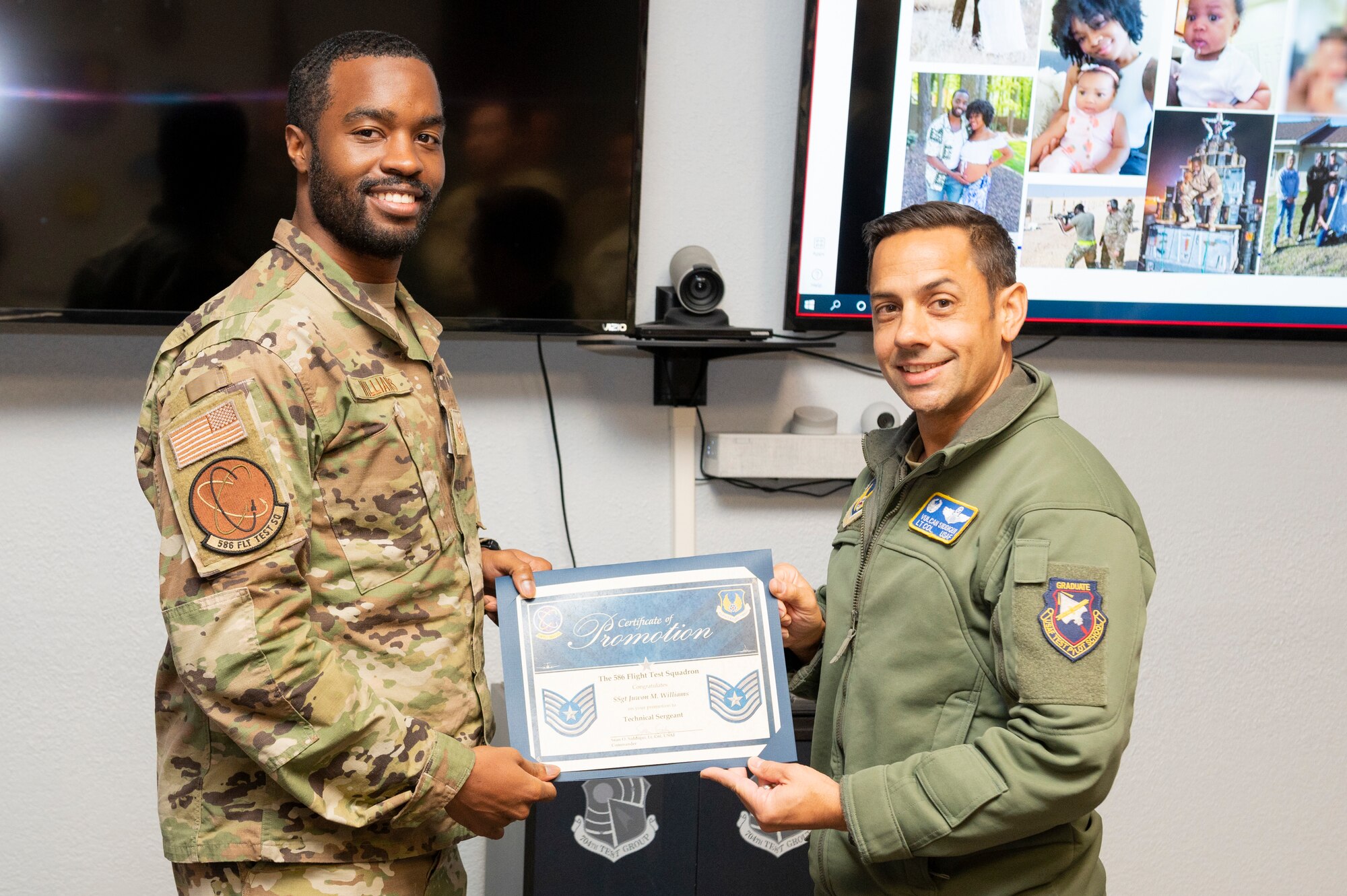 Newly-promoted Tech. Sgt. Juwon Williams, left, 586th Flight Test Squadron Munitions Systems noncommissioned officer in charge, poses with U.S. Air Force Lt. Col. Sean Siddiqui, 586th FLTS commander, after a surprise promotion at Holloman Air Force Base, New Mexico, Nov. 15, 2022