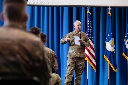 U.S. Air Force Maj. Gen. Joel Jackson, commander of the Air Force District of Washington, speaks during an all-call at Joint Base Anacostia-Bolling, Washington D.C., Dec. 8, 2022. Jackson highlighted the importance of the mission set of JBAB, which includes the unique role the base serves in supporting more than 70 mission partners spanning multiple military services and federal agencies. (U.S. Air Force photo by Airman 1st Class Bill Guilliam)