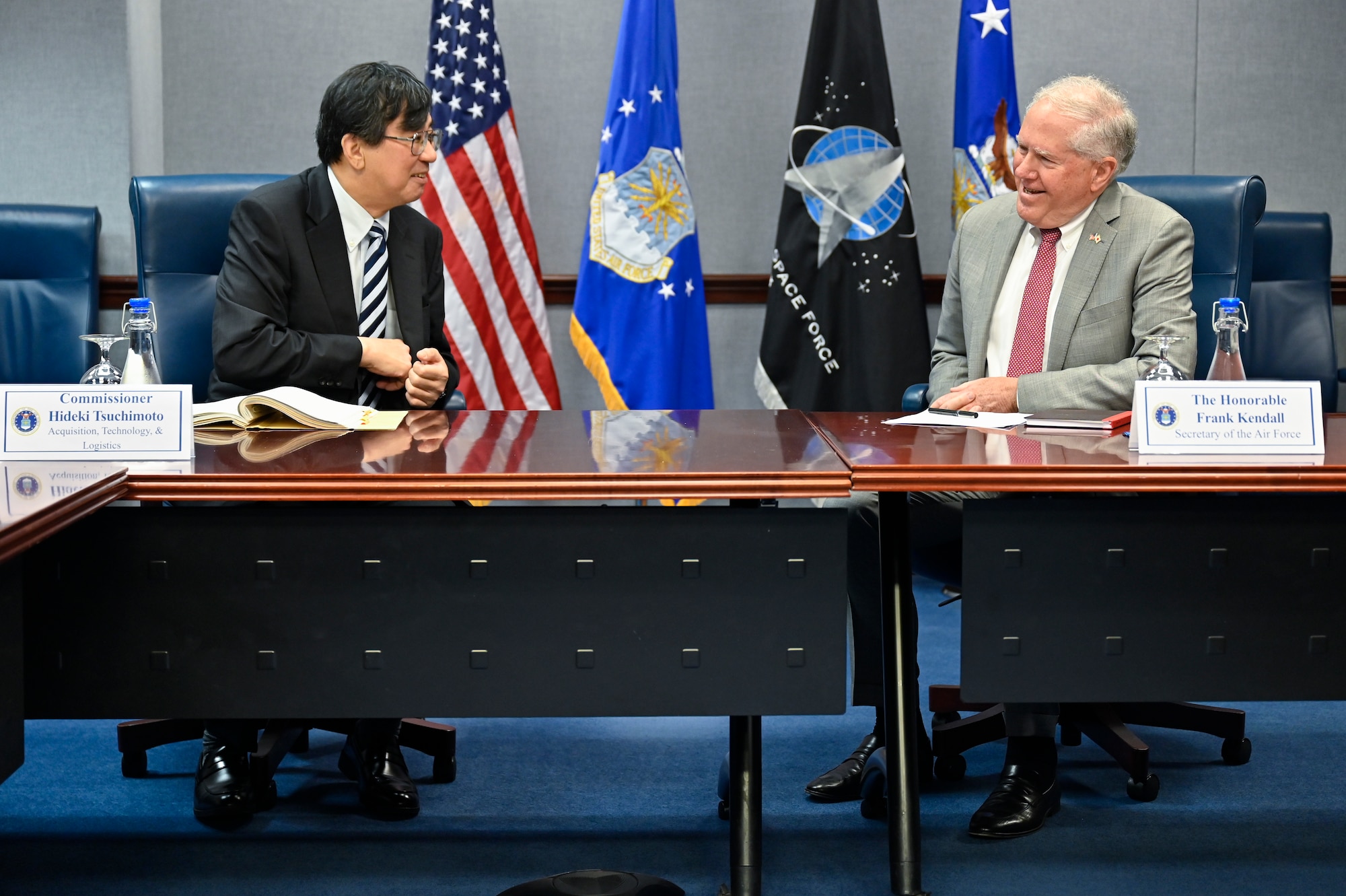 Secretary of the Air Force Frank Kendall speaks with Hideki Tsuchimoto, commissioner of the Acquisition, Technology and Logistics Agency, Japanese Ministry of Defense.