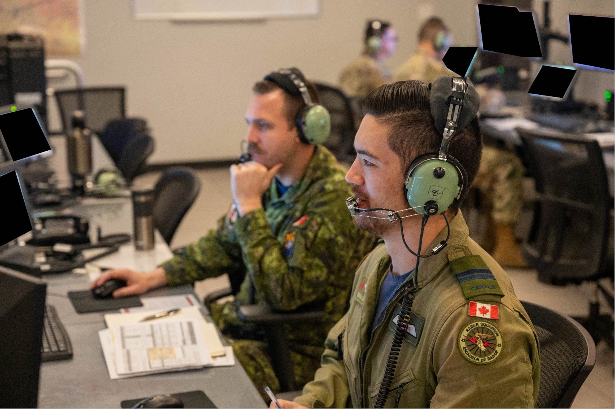 Royal Canadian Air Force Capt. Dennis Williams (right) and Capt. Derek Doerksen, 42 Radar Squadron air battle managers, control a simulated airspace during exercise Swift Strike, Nov. 23, 2022, at Luke Air Force Base, Arizona.
