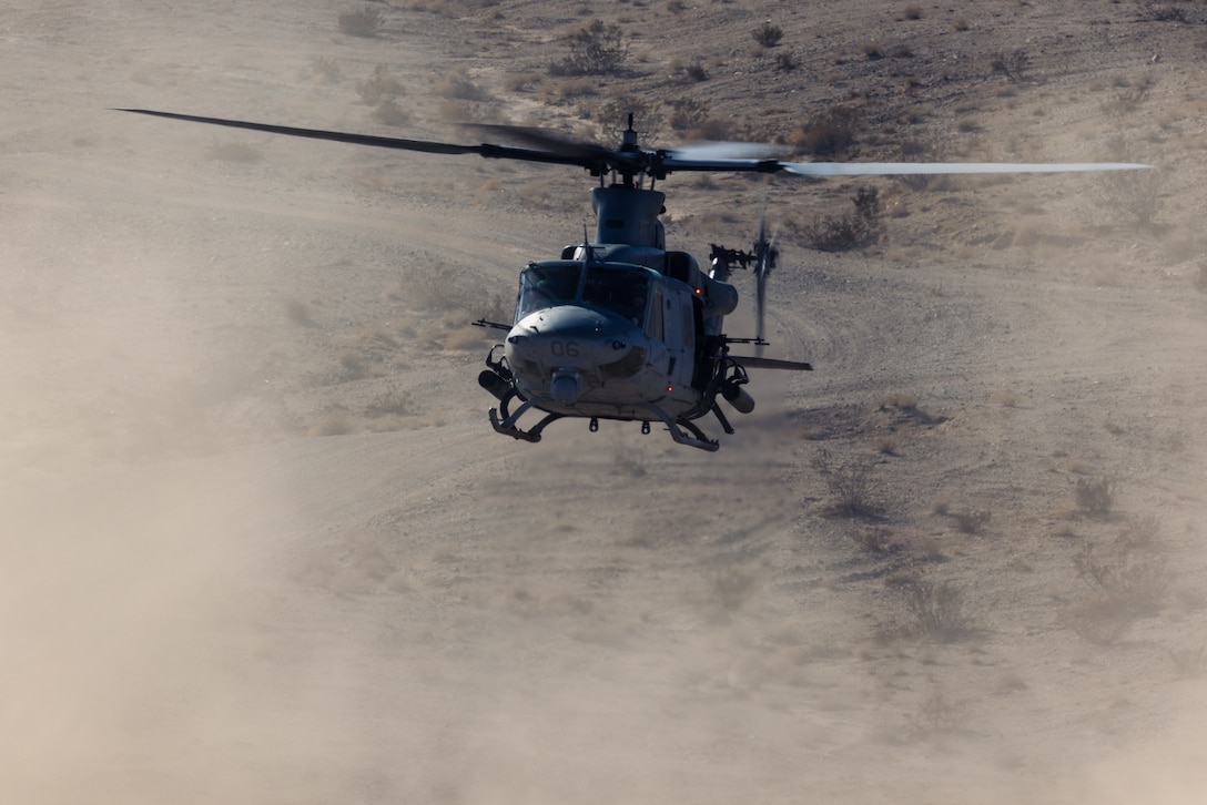 A U.S. Marine UH-1Y Venom helicopter with Marine Light Attack Helicopter Squadron 169, Marine Aircraft Group 39, 3rd Marine Aircraft Wing, lands for a simulated casualty evacuation during a fire support coordination exercise as part of Steel Knight 23 at Marine Corps Air Ground Combat Center Twentynine Palms, California, Dec. 1, 2022. Steel Knight is an annual combined arms live-fire exercise which ensures 1st MARDIV is optimized for naval expeditionary warfare in contested spaces, and is purpose-built to facilitate future operations afloat and ashore. (U.S. Marine Corps photo by Lance Cpl. Barton)