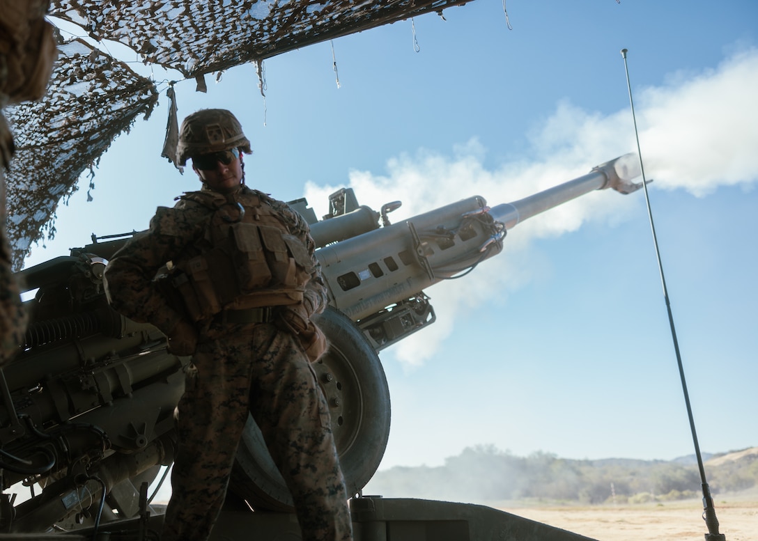 U.S. Marine Lance Cpl. Miranda, a field artillery cannoneer with India Battery, 1st Battalion, 11th Marine Regiment, 1st Marine Division, fires an M777A2 lightweight 155mm howitzer during an indirect fire training exercise as part of Steel Knight 23 at Marine Corps Base Camp Pendleton, California, Dec. 9, 2022. Steel Knight is an annual combined arms live-fire exercise which ensures 1st MARDIV is optimized for naval expeditionary warfare in contested spaces, and is purpose-built to facilitate future operations afloat and ashore. Miranda is a native of San Diego. (U.S. Marine Corps photo by Lance Cpl. Earik Barton)