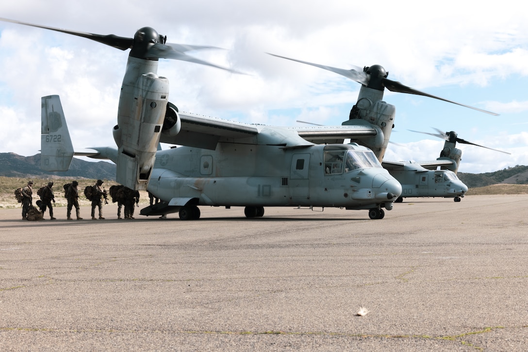 U.S. Marines with Lima Company, 3rd Battalion, 1st Marine Regiment, 1st Marine Division, board an MV-22B Osprey with Marine Medium Tiltrotor Squadron 164, Marine Aircraft Group 39, 3rd Marine Aircraft Wing, for an air assault as part of Steel Knight 23 at Marine Corps Base Camp Pendleton, California, Dec. 5, 2022. Steel Knight is an annual combined arms live-fire exercise which ensures 1st MARDIV is optimized for naval expeditionary warfare in contested spaces, and is purpose-built to facilitate future operations afloat and ashore. (U.S. Marine Corps photo by Lance Cpl. Daniel)