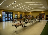 Team Charleston volunteers work together to package donated cookies.