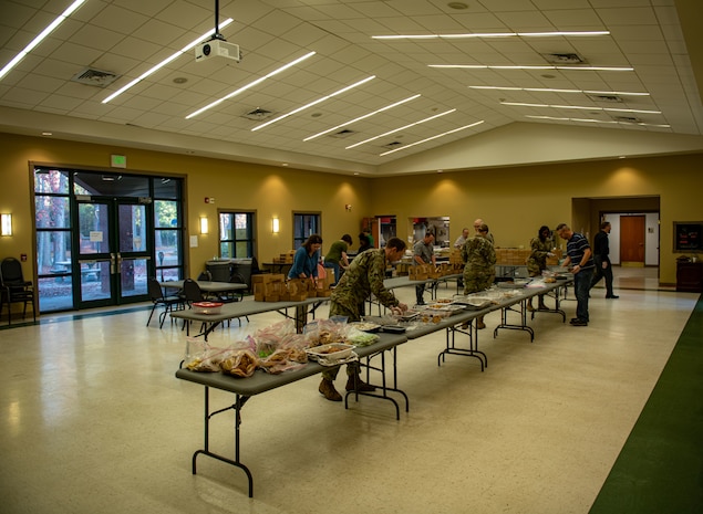 Team Charleston volunteers work together to package donated cookies.