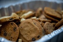 Chocolate chip cookies sit in a pan.