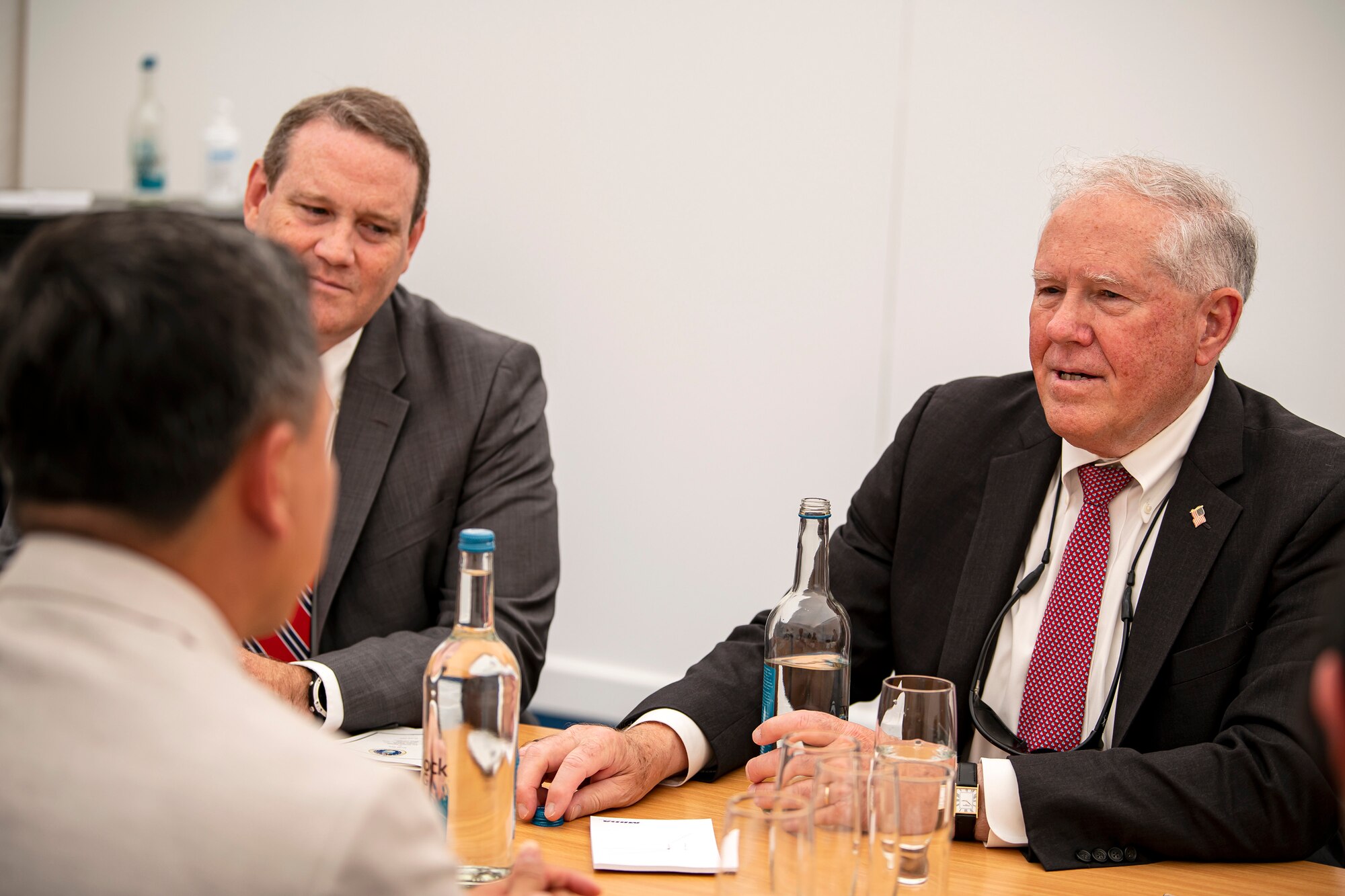 Secretary of the Air Force Frank Kendall, right, meets with Mervyn Tan Wei Ming, Chief Executive of the Defense Science and Technology Agency, Singapore