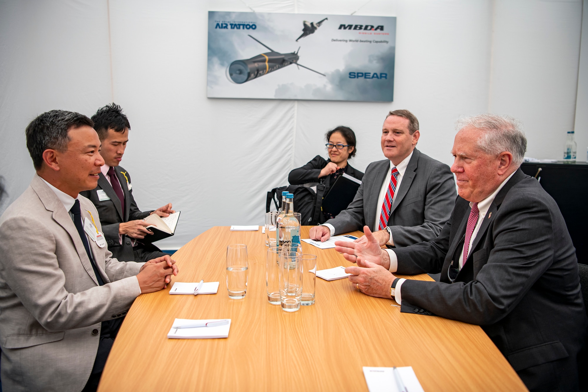 Secretary of the Air Force Frank Kendall, right, meets with Mervyn Tan Wei Ming, Chief Executive of the Defense Science and Technology Agency.