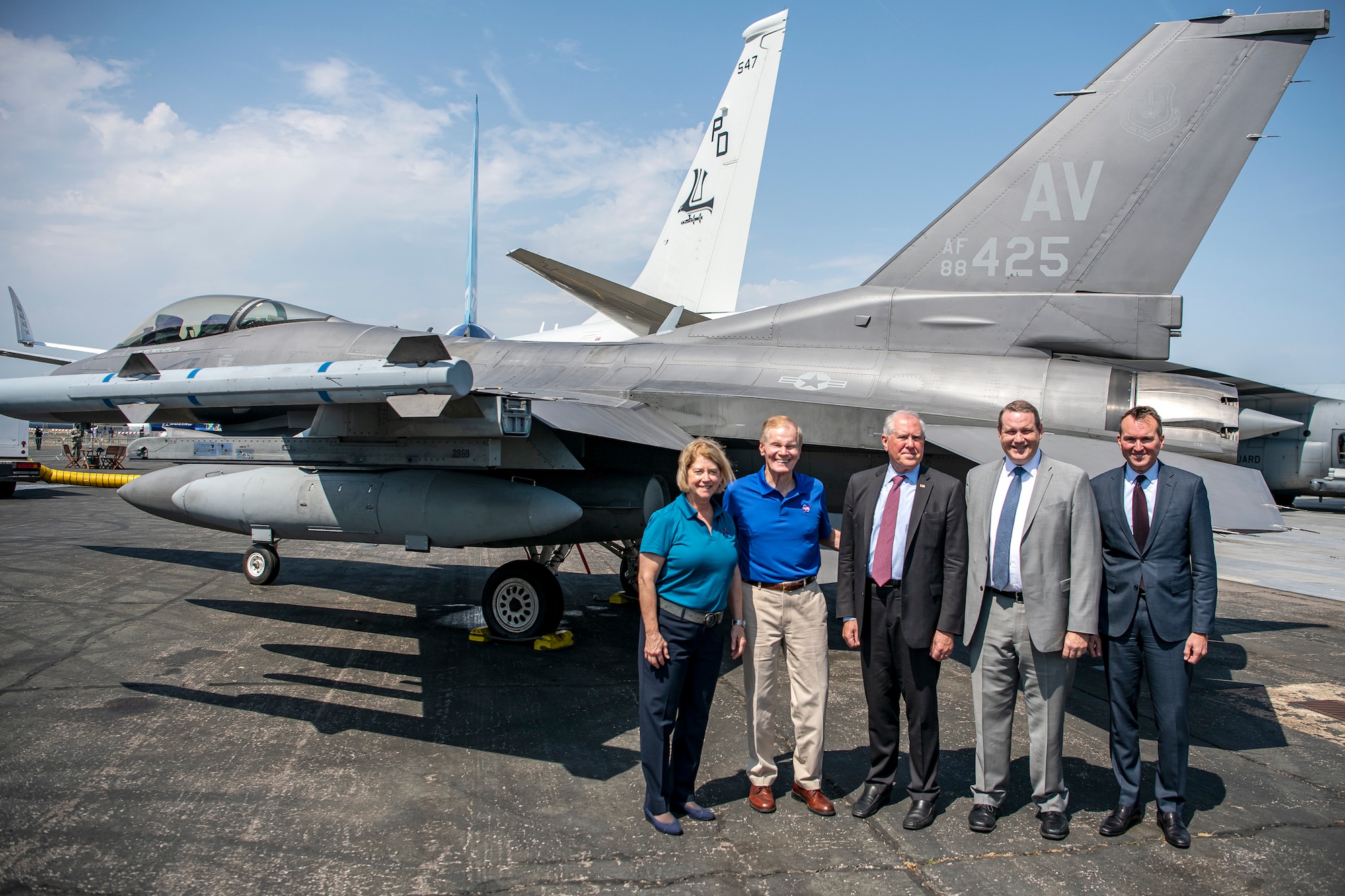 Secretary of the Air Force Frank Kendall, center, poses for a photo along with Bill Nelson, center left, NASA administrator, and other attendees at the Farnborough International Airshow.