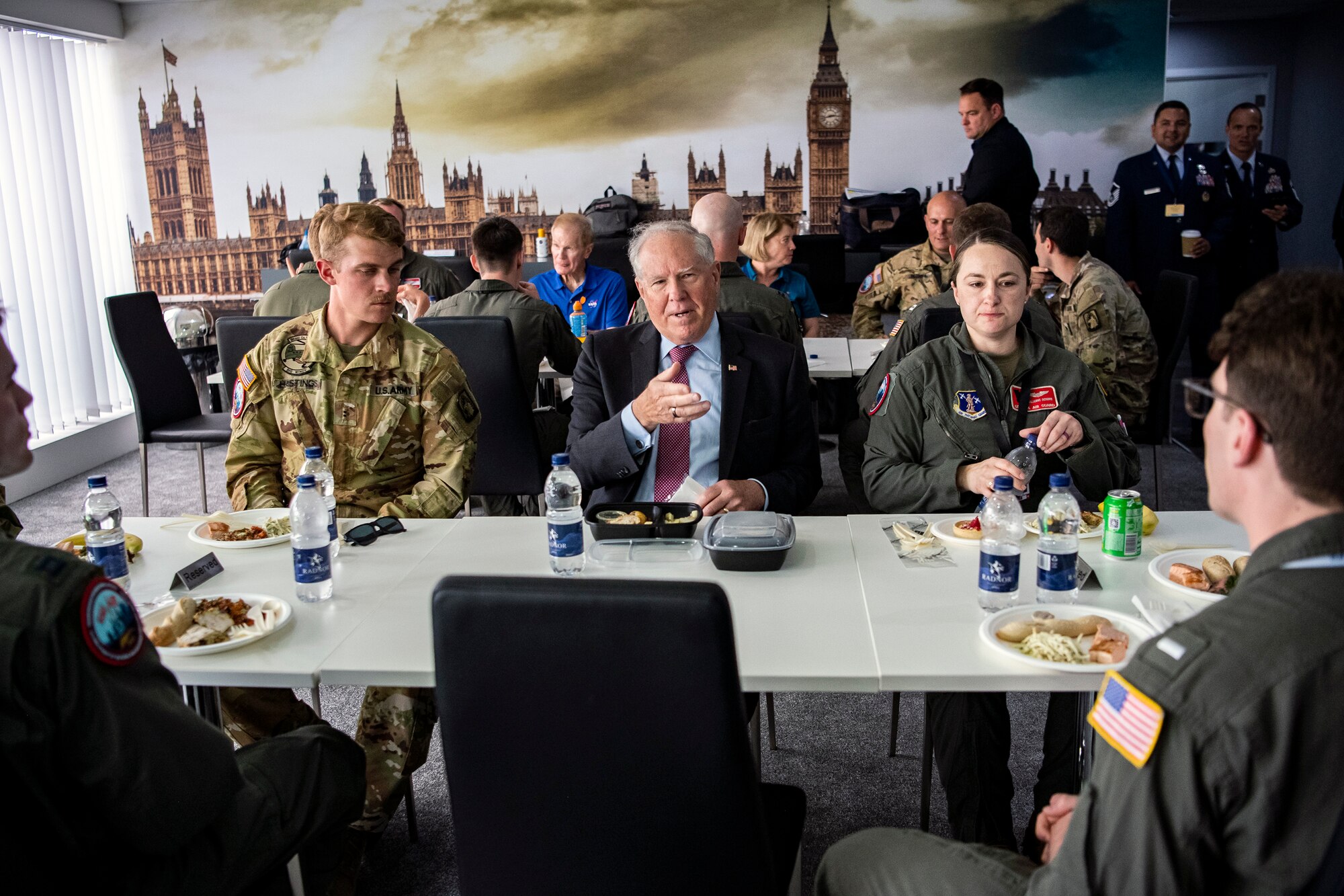 Secretary of the Air Force Frank Kendall meets with servicemembers during the Farnborough International Airshow.