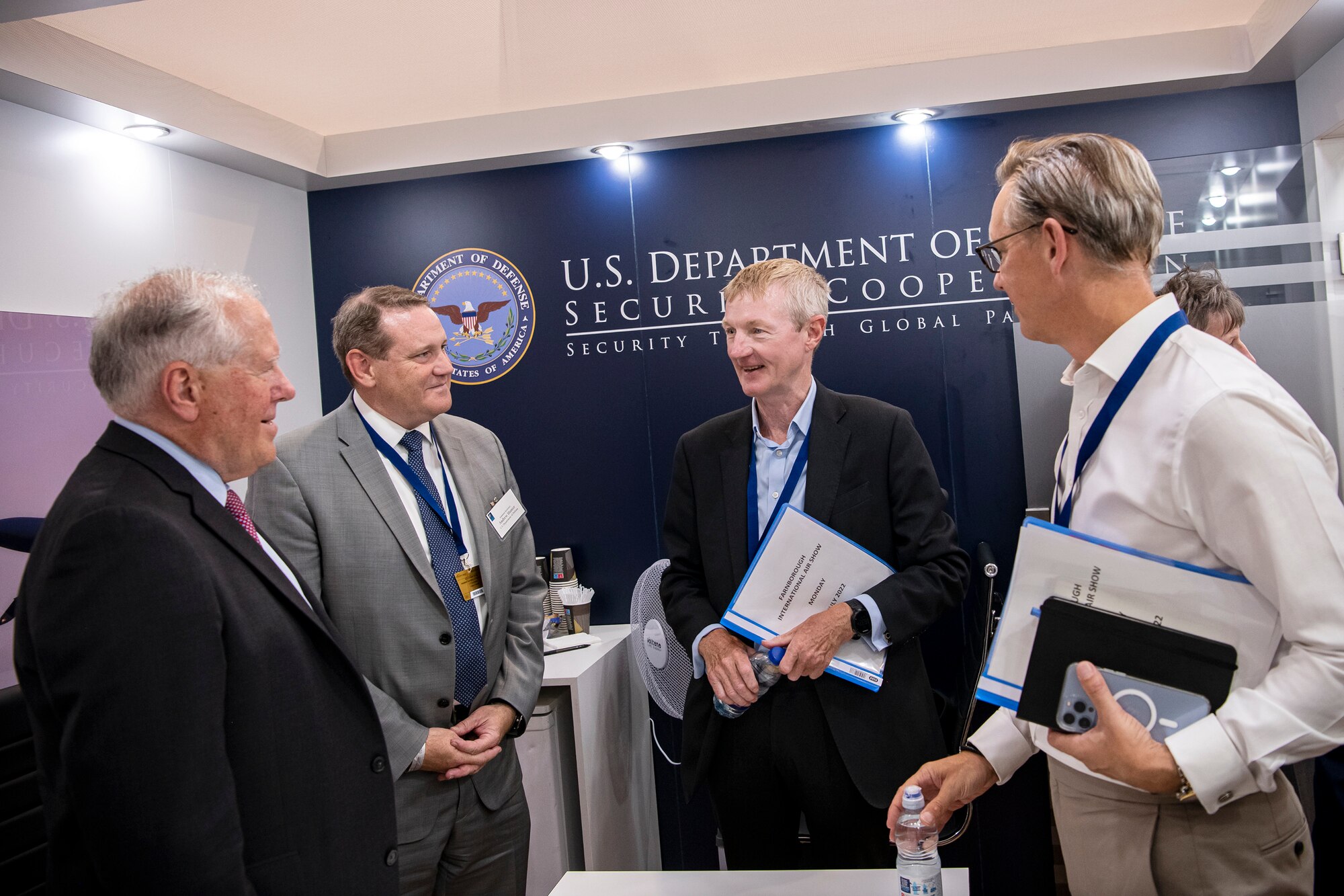 Secretary of the Air Force Frank Kendall, left, speaks with Sir Simon Bollom, Chief Executive of Defence Equipment and Support, UK Ministry of Defence.