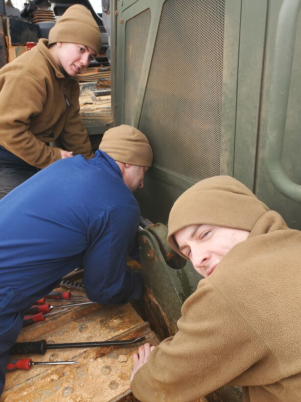 Col Scottie Redden, Detachment CO, turns wrenches with the Engineer Maintenance Marines.
