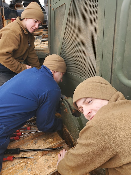 Col Scottie Redden, Detachment CO, turns wrenches with the Engineer Maintenance Marines.