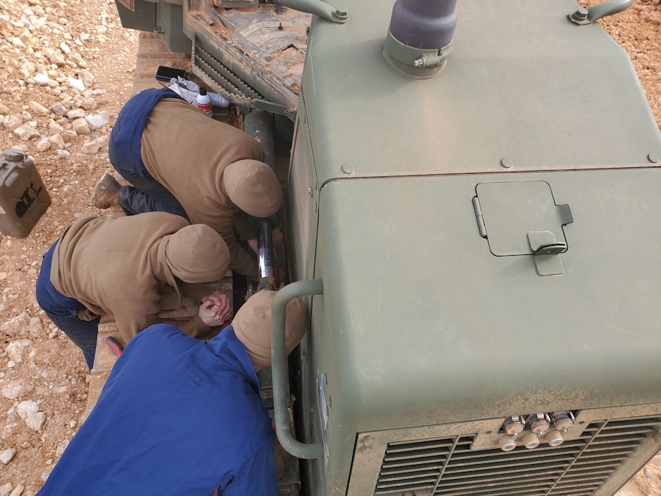 Col Scottie Redden, Detachment CO, turns wrenches with the Engineer Maintenance Marines.