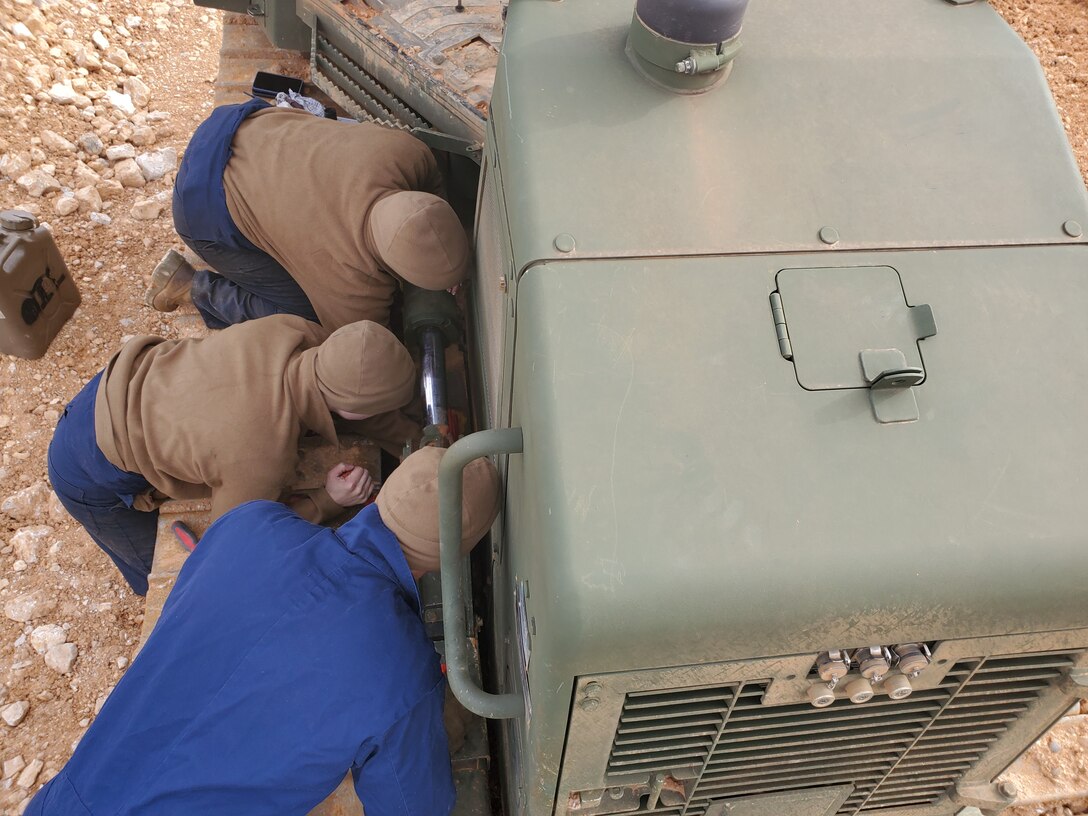 Col Scottie Redden, Detachment CO, turns wrenches with the Engineer Maintenance Marines.