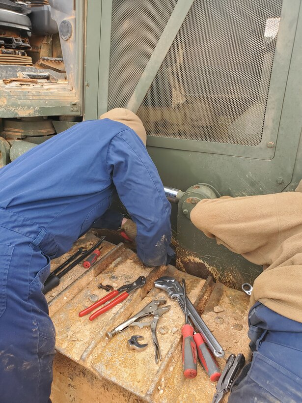 Col Scottie Redden, Detachment CO, turns wrenches with the Engineer Maintenance Marines.