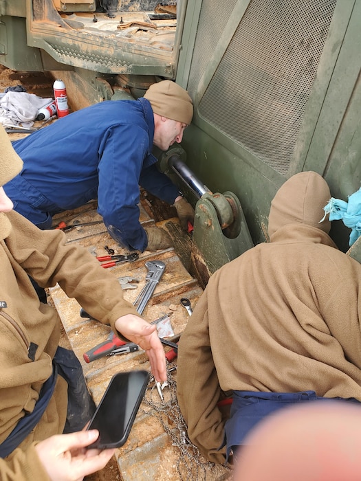 Col Scottie Redden, Detachment CO, turns wrenches with the Engineer Maintenance Marines.