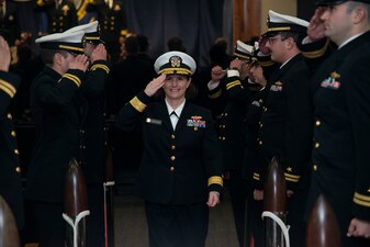 NEWPORT, R.I. (Dec. 8, 2022) Rear Adm. Jennifer Couture, commander, Naval Service Training Command, passes through sideboys exiting the Department Head Class 269 graduation ceremony at Surface Warfare Schools Command (SWSC) on Naval Station Newport, Dec. 8, 2022.  The SWSC Department Head Course is the cornerstone of a surface warfare officer's (SWO) tactical education in their naval career. Upon the conclusion of the graduation ceremony, Department Head Class 269 will take the knowledge back to the fleet, where they will teach the next generation of SWOs. These career naval professionals are part of a long tradition of 60 years of excellence at SWSC, previously known as Surface Warfare Officers School Command. (U.S. Navy photo by Mass Communication Specialist 2nd Class Derien C. Luce)