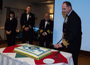 NEWPORT, R.I. (Dec. 2, 2022) Capt. Charles Varsogea, commanding officer, Naval Chaplaincy School, cuts the cake during the Navy Chaplain Ball, at the Green Valley Country Club, Dec. 2, 2022. This year's event celebrates 247 years since the formation of the Navy Chaplain Corps. (U.S. Navy photo by Mass Communication Specialist 2nd Class Derien C. Luce)