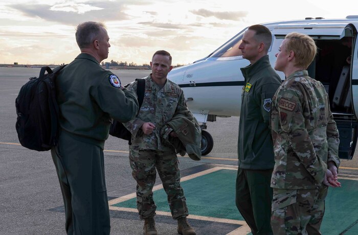 U.S. Air Force Gen. Mark Kelly, commander of Air Combat Command, and Air Combat Command Chief Master Sgt. John Storms meet with Col. Geoffrey Church, 9th Reconnaissance Wing commander, and 9th Reconnaissance Wing Command Chief Master Sgt. Breanna Oliver on Beale Air Force Base, Calif. on Dec. 6, 2022.