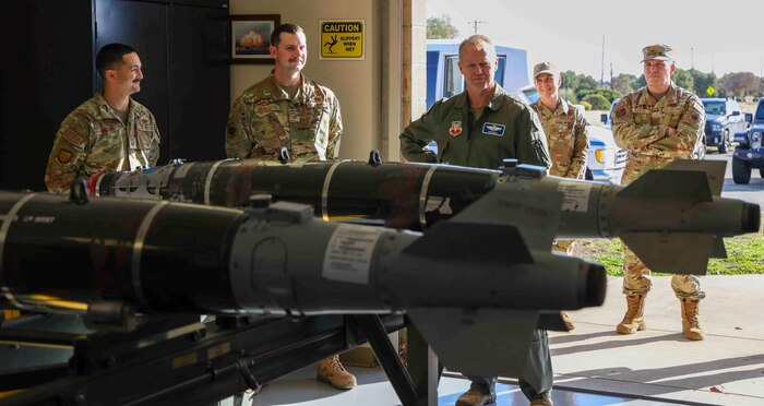 U.S. Air Force Gen. Mark Kelly, commander of Air Combat Command, observes the 9th Munitions Squadron Air Force Combat Ammunition Center capabilities at Beale Air Force Base, Calif. on Dec. 6, 2022.