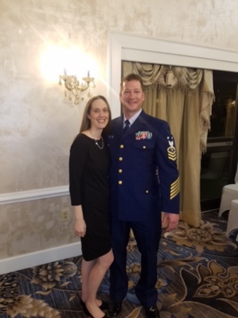 Master Chief David Cahilly and his wife, Brooke, attend the Chief’s Call to Indoctrination dinner at Fort Eustis, Virginia, May 18, 2012. Cahilly serves as the damage controlman rating force master chief for the Coast Guard, ensuring the DC enlisted workforce is represented at the headquarters level. (USCG photo)