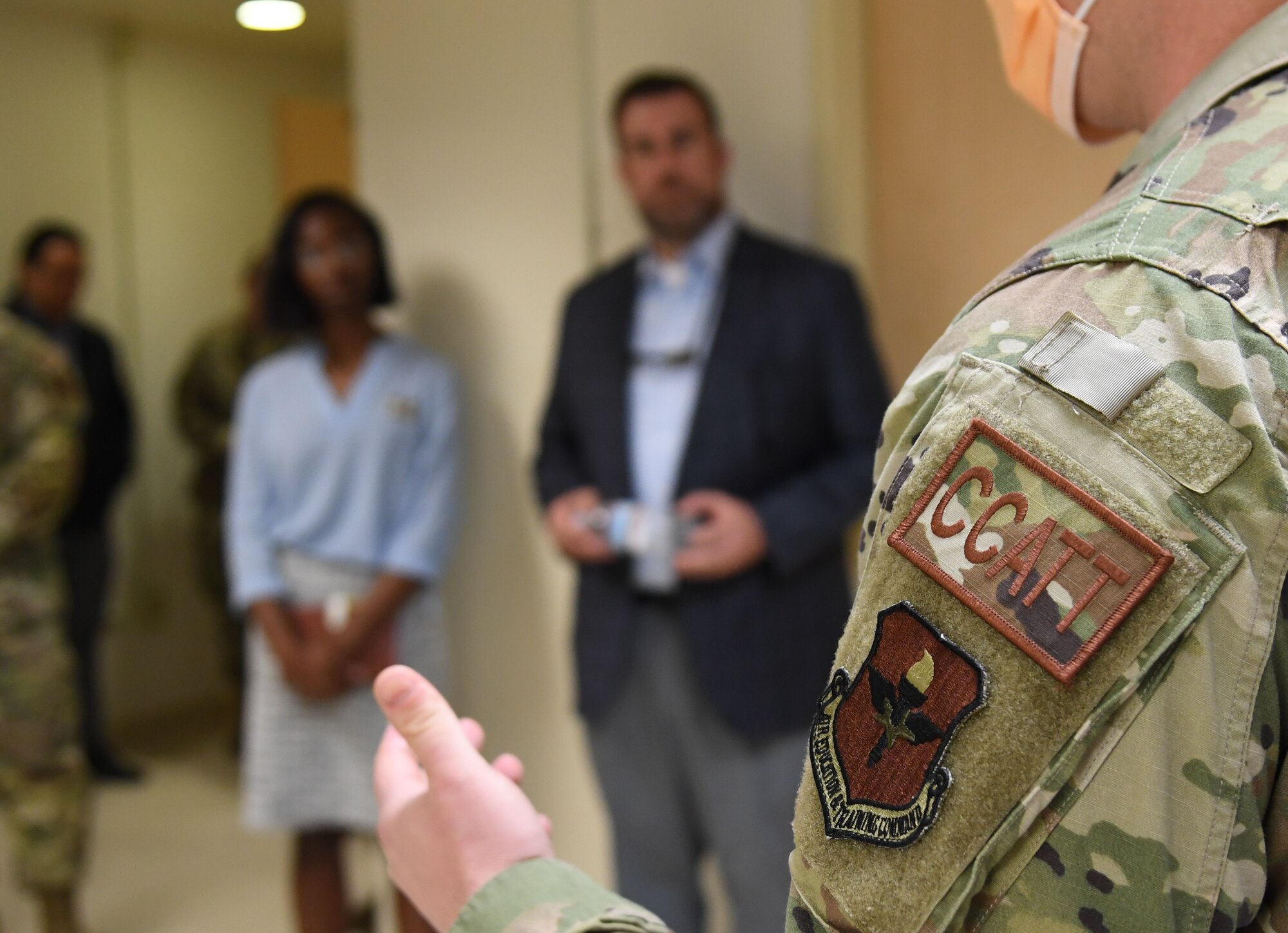 U.S. Air Force Maj. Ryan Anderson, 81st Healthcare Operations Squadron emergency room medical director, discusses the critical care air transport capabilities with state and local civic leaders during A Day At Keesler inside the Keesler Medical Center at Keesler Air Force Base, Mississippi, Dec. 9, 2022.