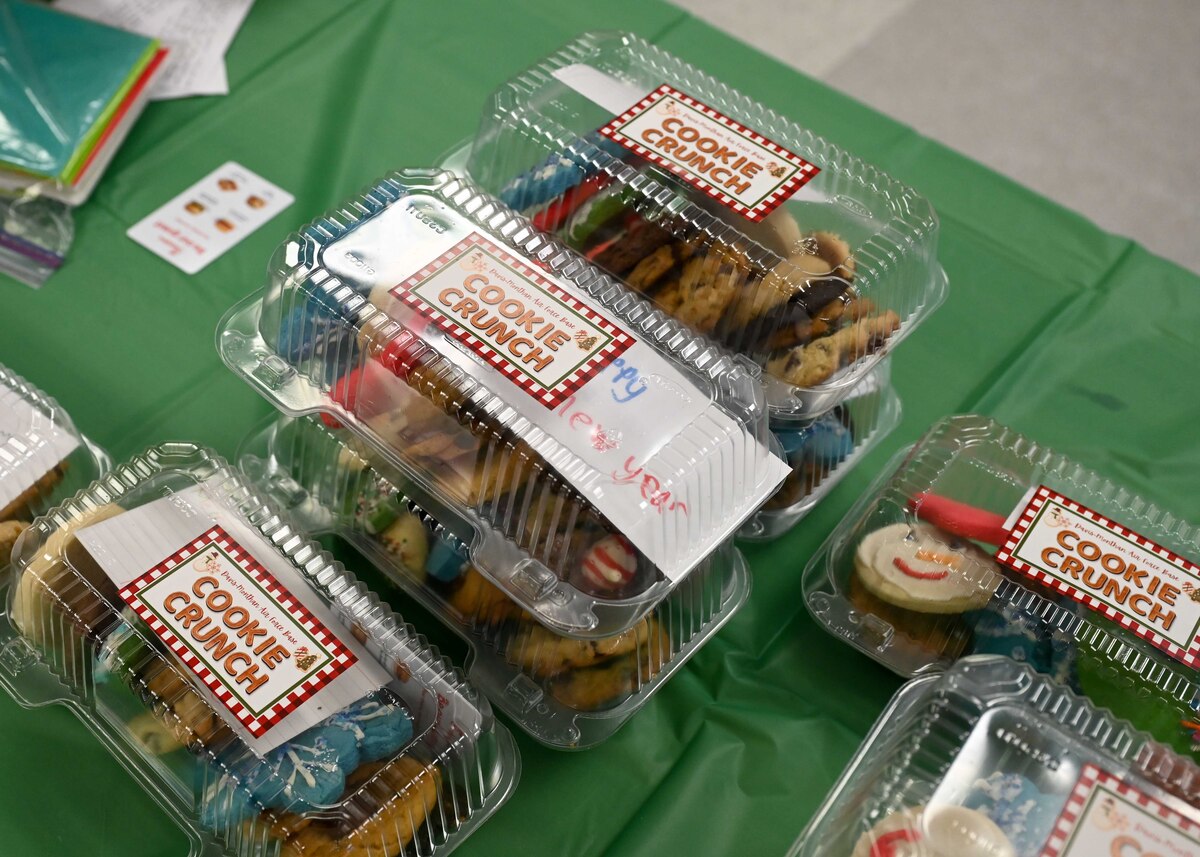 A photo of donated cookies in plastic contains with a sticker that says "Cookie Crunch" on the top.