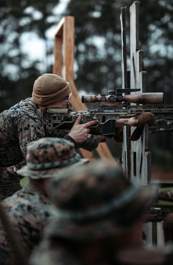 A U.S. Marine with 2d Marine Regiment, 2d Marine Division, sights in on a target during a regimental field exercise on Camp Lejeune, North Carolina, Dec. 6, 2022. Marines conducted the FEX to enhance combat capabilities while maintaining operational readiness throughout the regiment. (U.S. Marine Corps photo by Lance Cpl. Isabella R. Mancini)