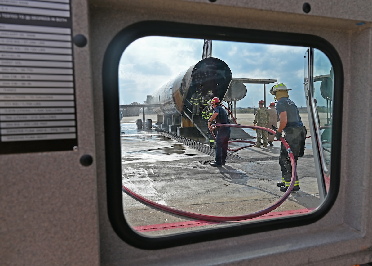 The San Angelo Fire Department receives its annual Airport Rescue Fire Fighting certification training at the Louis F. Garland Department of Defense Fire Academy, Goodfellow Air Force Base, Texas, Dec. 8, 2022. Through a mutual agreement, the 17th Training Wing allowed SAFD to receive advanced training and obtain their annual qualifications with Goodfellow’s facilities. (U.S. Air Force photo by Senior Airman Abbey Rieves)