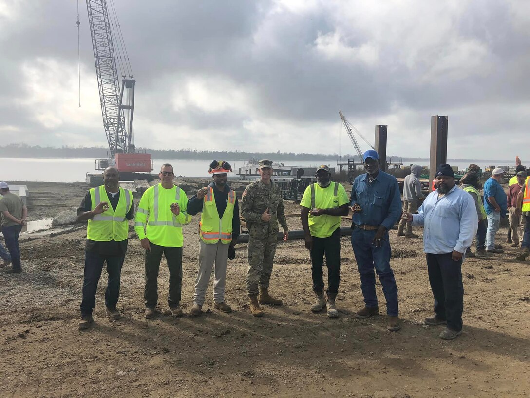 Memphis District Commander Col. Brian Sawser recently visited St. Francisville, a project site in Louisiana, where he met with the district’s hardworking Revetment Team and reviewed progress made at the site thus far. Our Memphis District uses a vintage 1949 barge mounted Bucyrus-Erie dragline with a 183 foot boom and a 15 cubic yard bucket to complete grading operations. Additional earthmoving capacity is provided by a compliment of bulldozers.