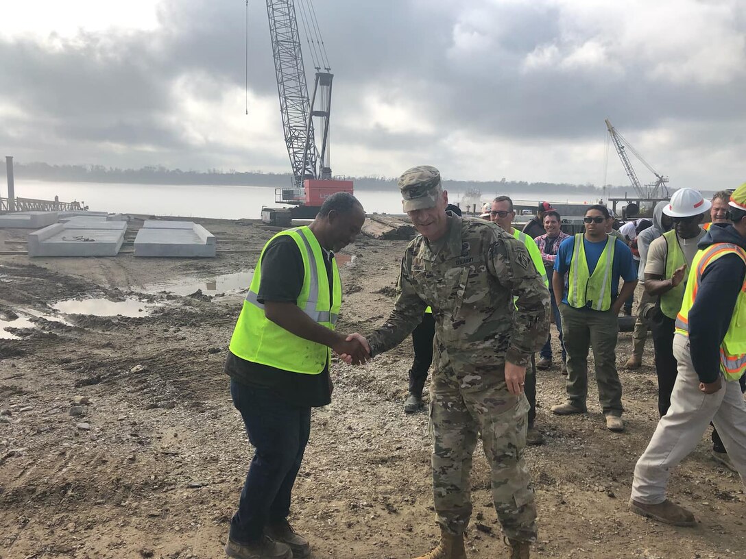 Memphis District Commander Col. Brian Sawser recently visited St. Francisville, a project site in Louisiana, where he met with the district’s hardworking Revetment Team and reviewed progress made at the site thus far. Our Memphis District uses a vintage 1949 barge mounted Bucyrus-Erie dragline with a 183 foot boom and a 15 cubic yard bucket to complete grading operations. Additional earthmoving capacity is provided by a compliment of bulldozers.