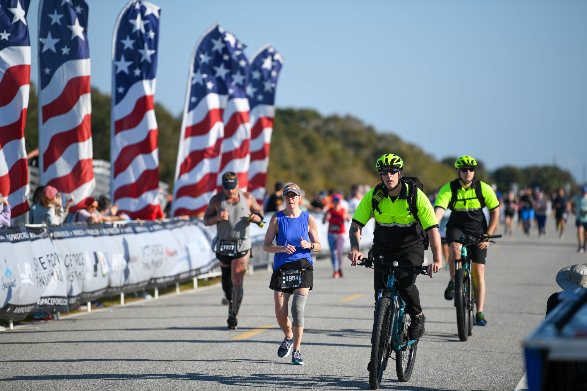 Bike medics from the Patrick Space Force Base Fire Department ride along participants at the T-minus 10-Miler on Dec. 10, 2022 at Cape Canaveral Space Force Station, Fla. Bike medics provide rapid response to those injured.