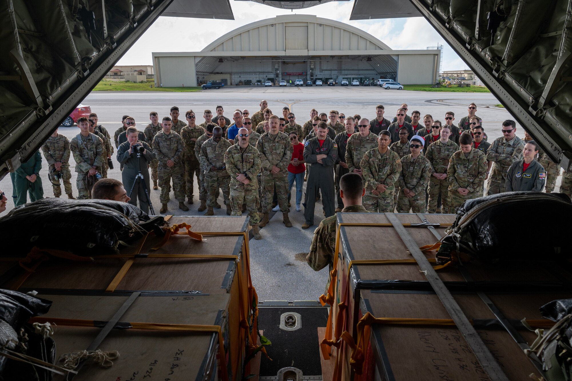 Participants of Operation Christmas Drop 2022 attend a memorial service for Senior Airman Jeremy Jutba-Hake