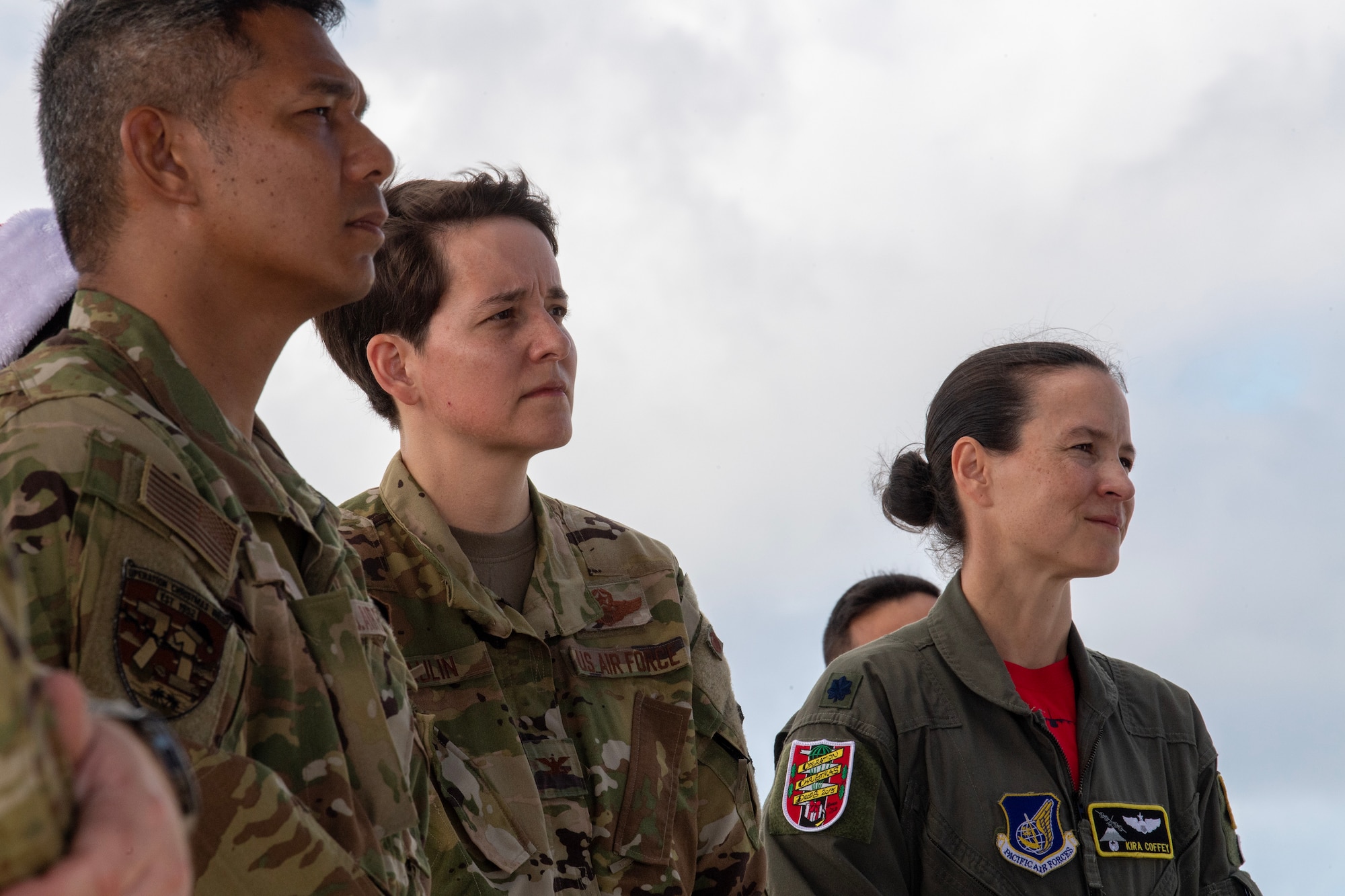 U.S. Air Force Airmen listen to remarks during a memorial ceremony