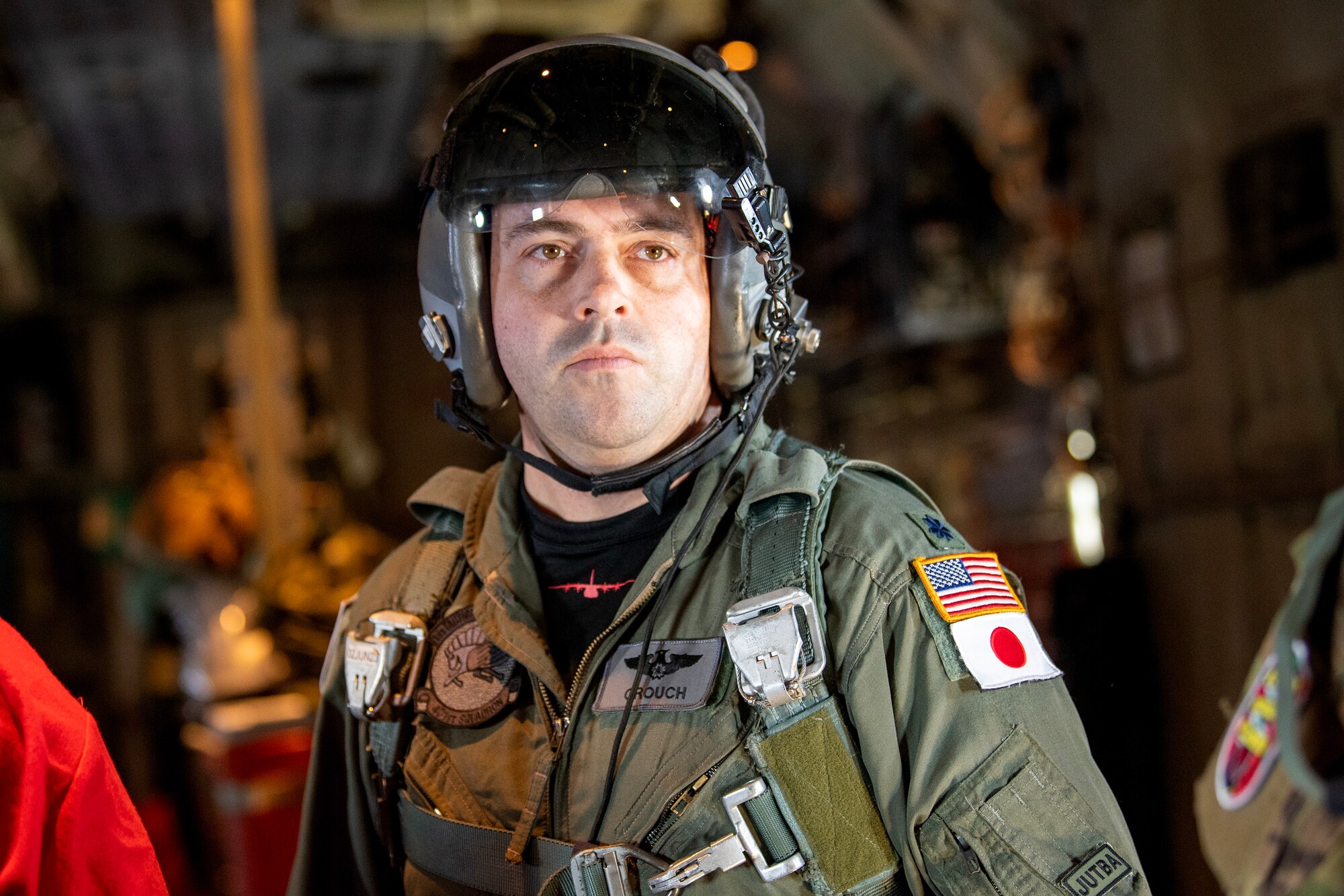 A U.S. Air Force pilot waits for the ramp of a C-130J Super Hercules to open