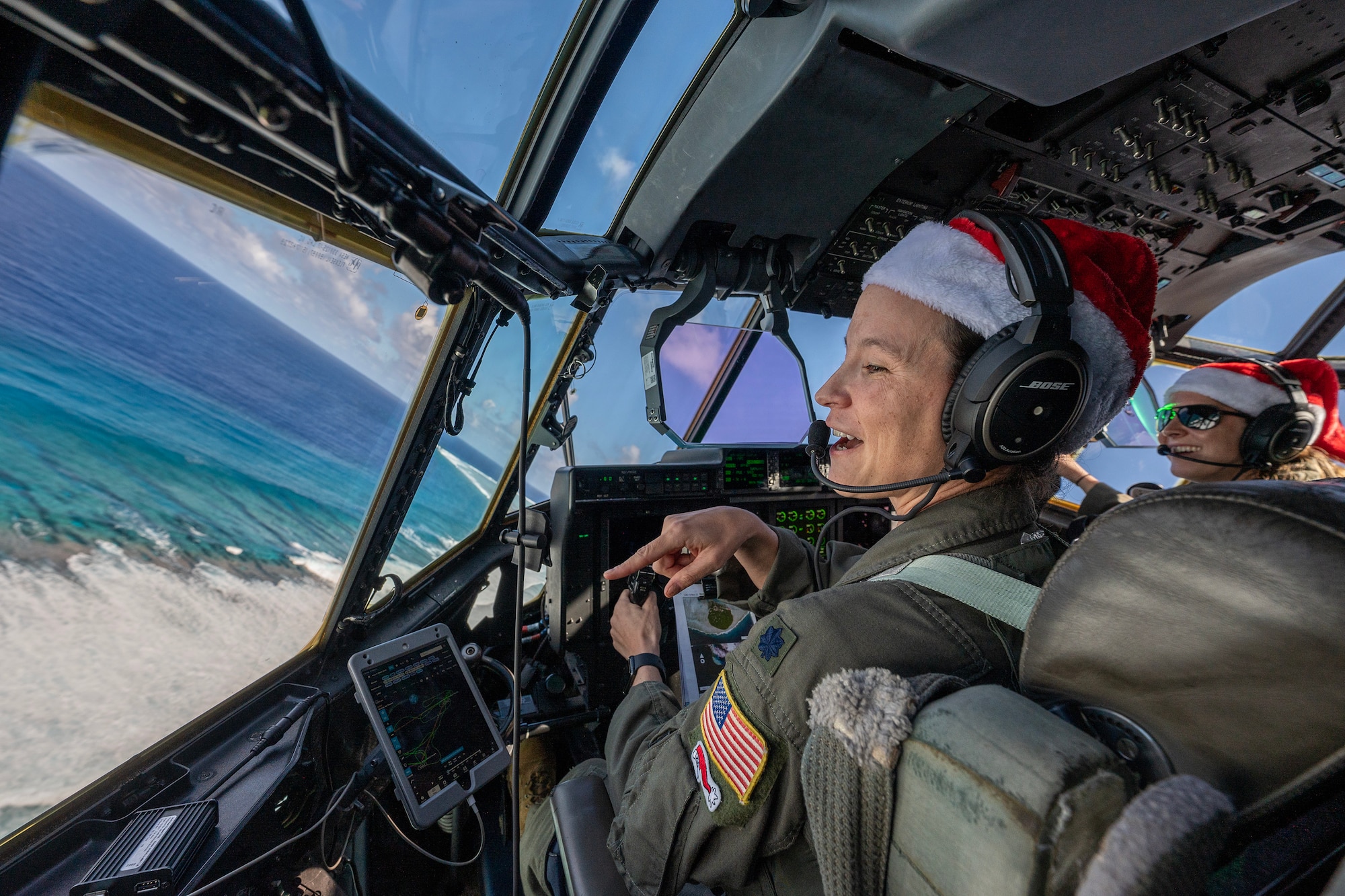 A U.S. Air Force pilot flies over the ocean in a C-130J Super Hercules