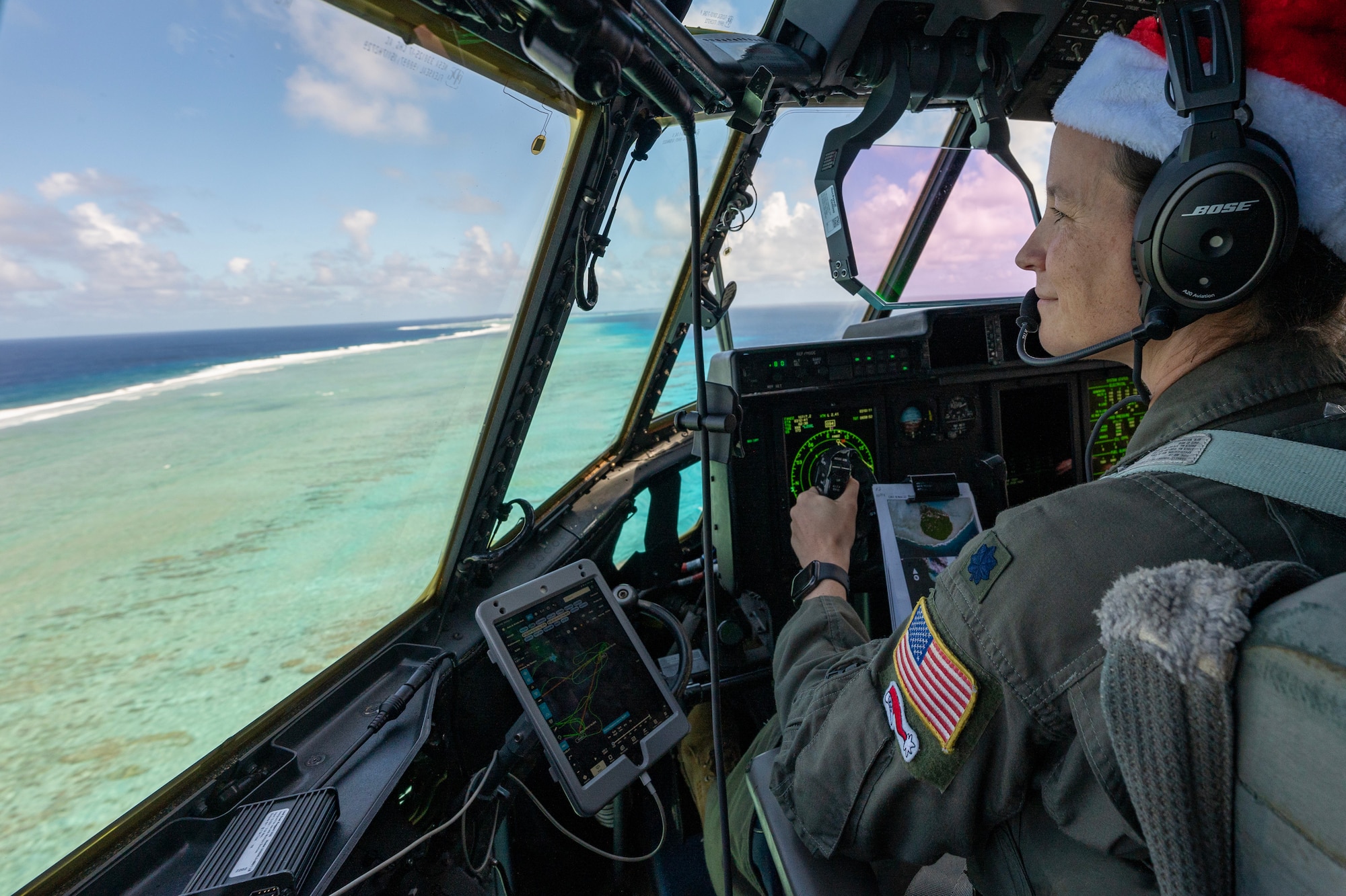 A U.S. Air Force pilot flies over the ocean in a C-130J Super Hercules