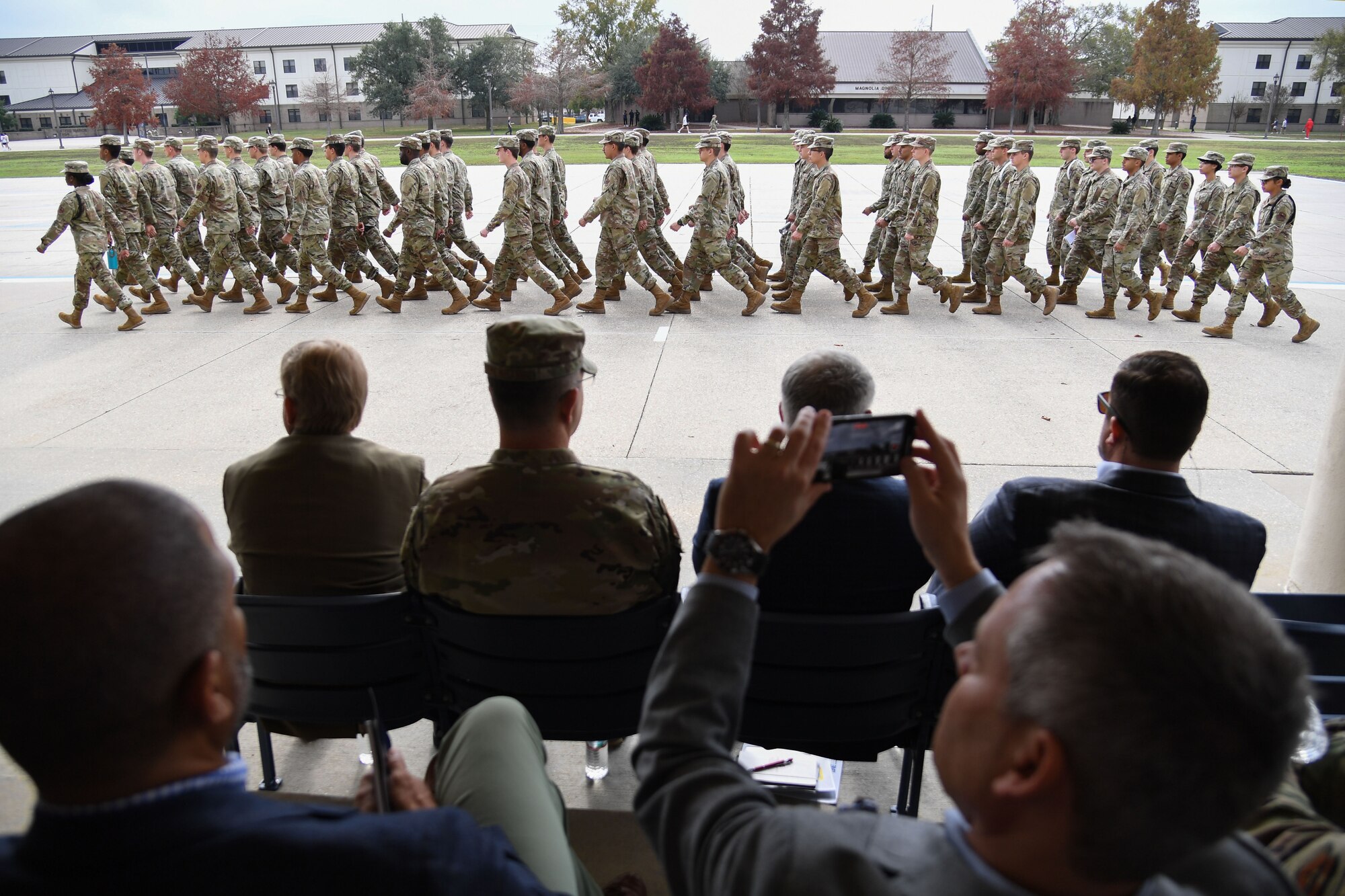 State and local civic leaders watch Airmen from the 81st Training Group march by during A Day At Keesler outside the Levitow Training Support Facility at Keesler Air Force Base, Mississippi, Dec. 9, 2022.