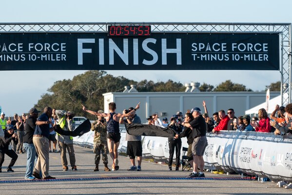 T-Minus 10-Miler participant crosses finish line on Dec. 10, 2022 at Cape Canaveral Space force Station, Fla. The fastest run time at the T-Minus 10-miler was 54 minutes, 53 seconds.