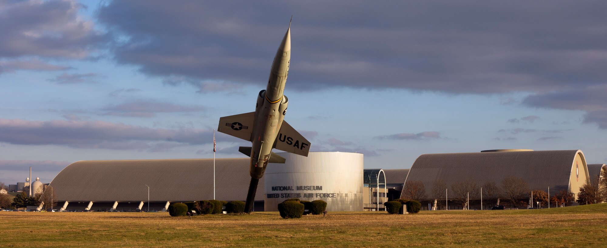 Exterior view of the National Museum of the United States Air Force features a Lockheed F-104 Starfighter.