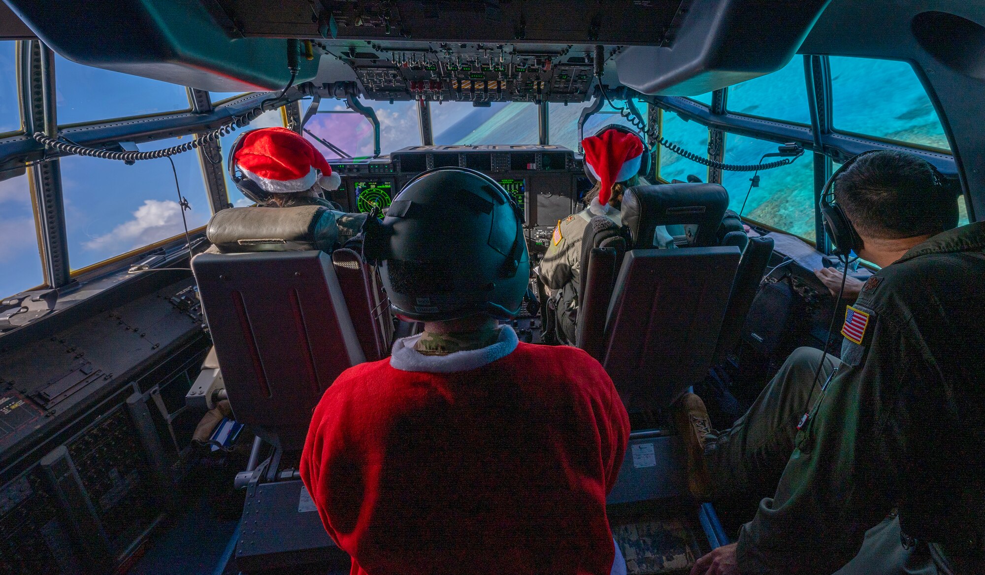 Aircrew with the 36th Expeditionary Airlift Squadron fly over Nomwin atoll