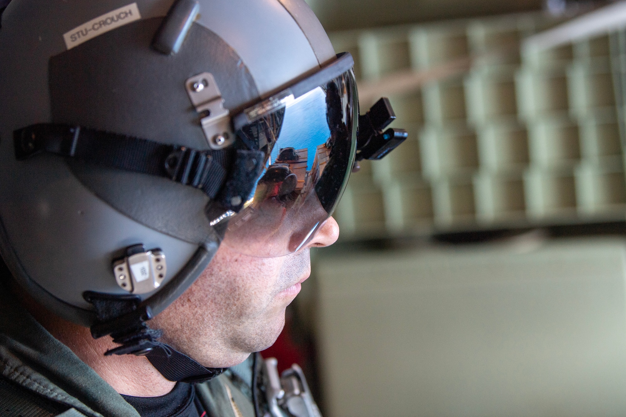 A U.S. Air Force officer looks at a memorial bundle
