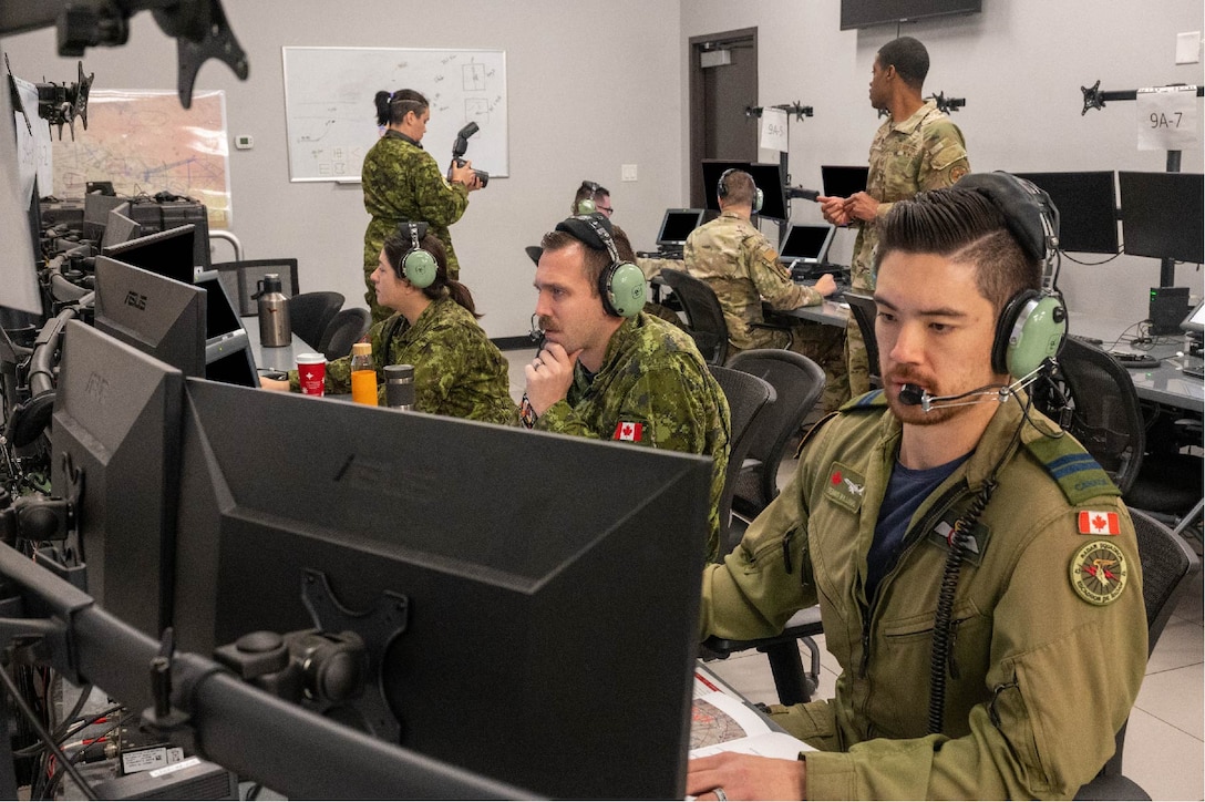 Royal Canadian Air Force Airmen from 42 Radar Squadron and U.S. Air Force Airmen from the 607th Air Control Squadron control simulated airspaces during exercise Swift Strike, Nov. 23, 2022, at Luke Air Force Base, Arizona.
