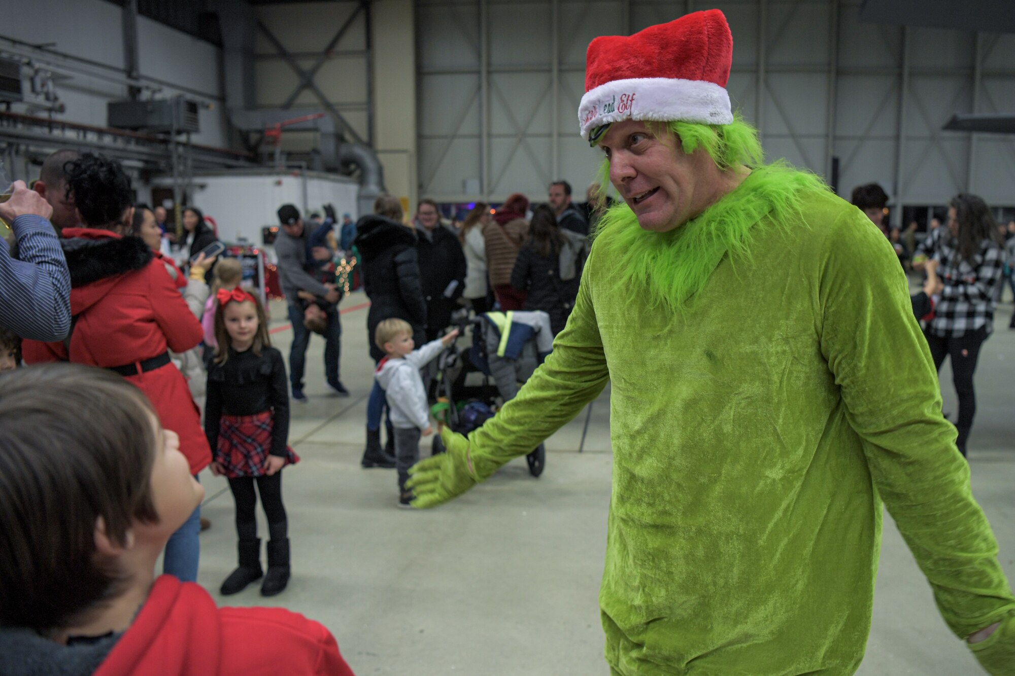 The Grinch interacts with children