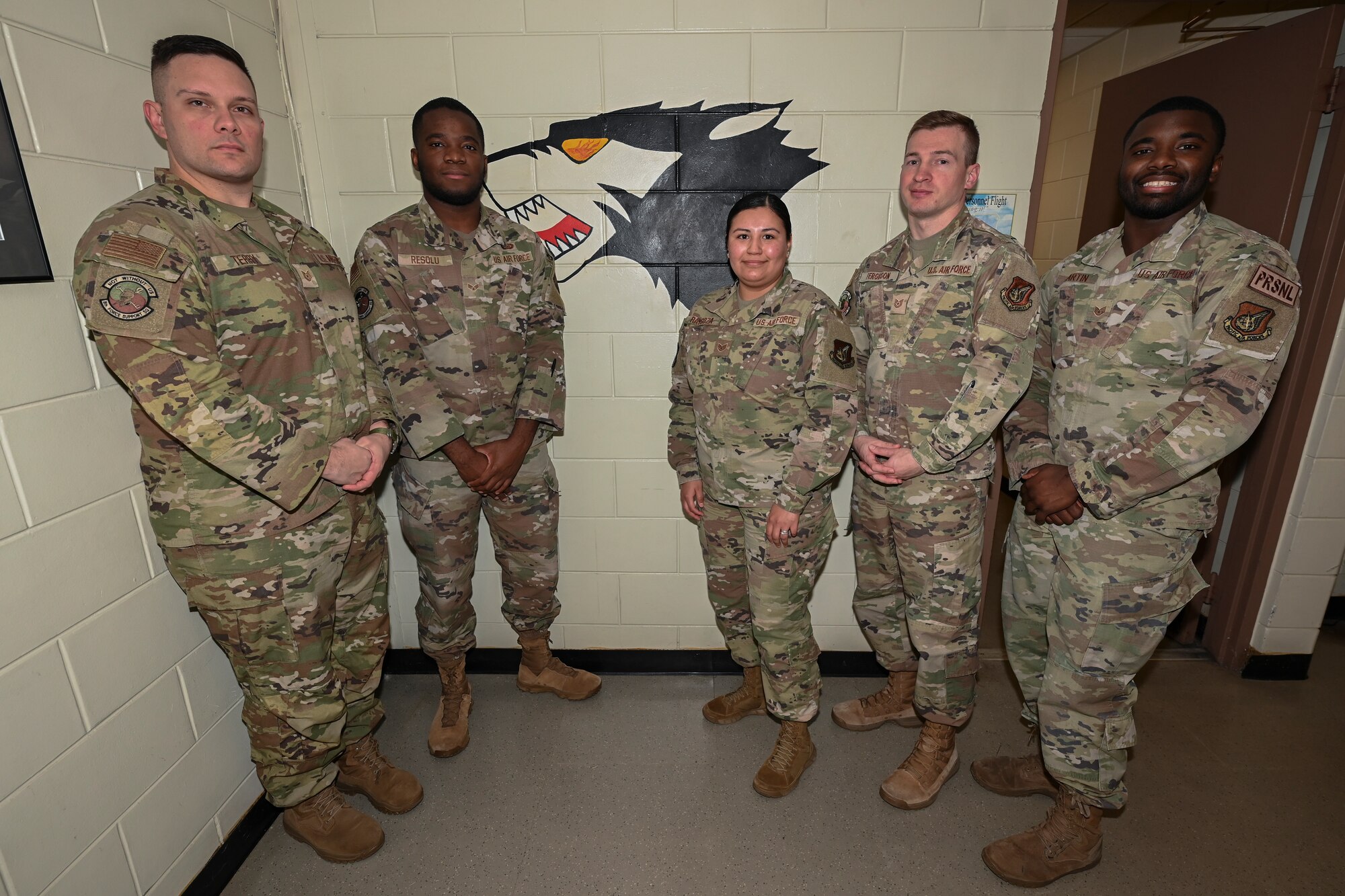 A group of Airmen pose for a photo.