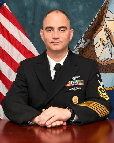 Master Chief Brandt poses for a photo